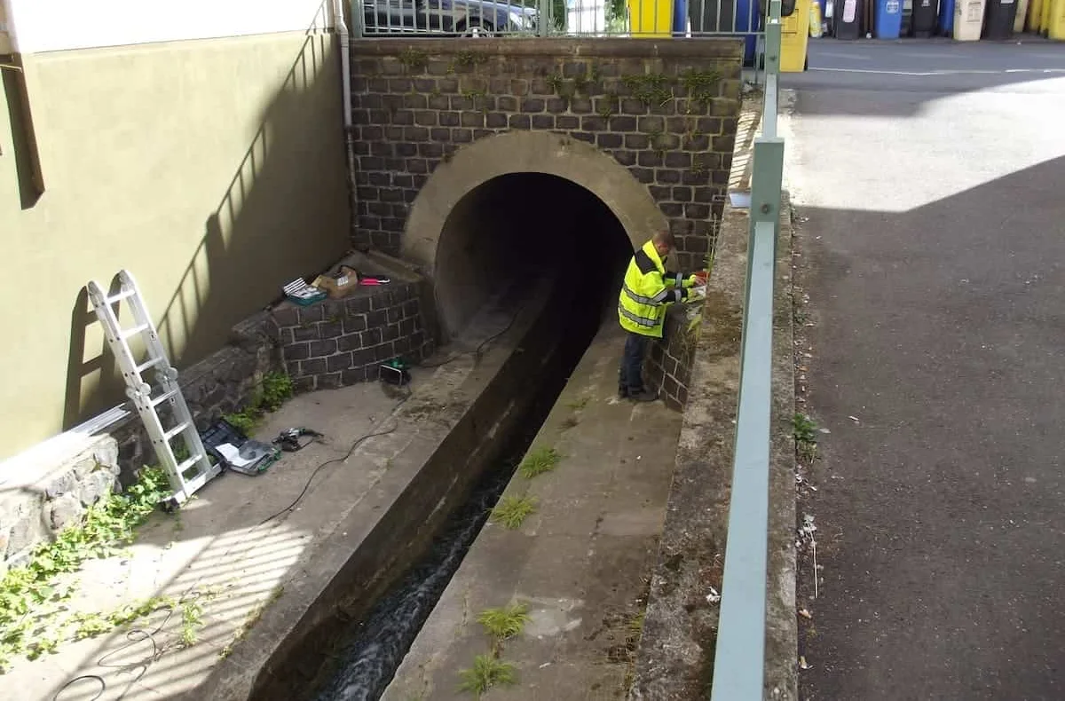 Installation of the sensors on a small bridge structure over a stream